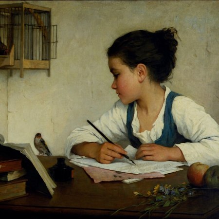 Girl writing with pet goldfinch