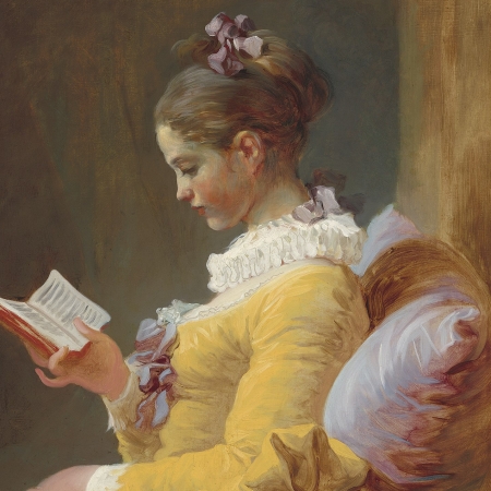 Girl in yellow dress reading a book